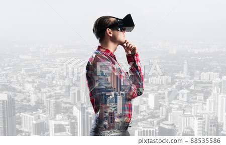 Guy wearing checked shirt and virtual mask with hand on chin 88535586