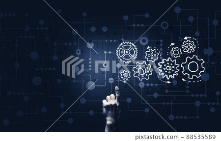 Glowing cogwheel mechanism icon on dark background as symbol of teamwork Glowing cogwheel mechanism icon on dark background as symbol of teamwork 88535589
