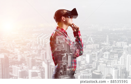 Guy wearing checked shirt and virtual mask with hand on chin Guy wearing checked shirt and virtual mask with hand on chin 88535591
