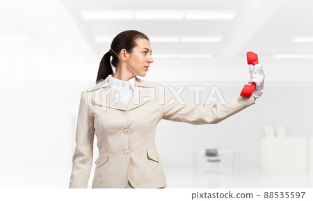 Woman keep at distance vintage red phone Woman keep at distance vintage red phone 88535597