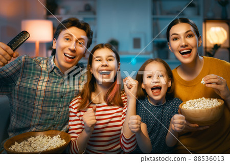 Mother, father and daughters spending time together. Mother, father and daughters spending time together. 88536013