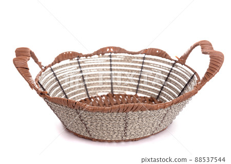 knitted basket with metal inserts and handles on a white background 88537544