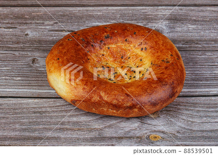 Traditional Uzbek bread with sesame seeds Traditional Uzbek bread with sesame seeds 88539501