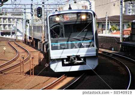 A commuter train that runs fast toward Odawara A commuter train that runs fast toward Odawara 88540919