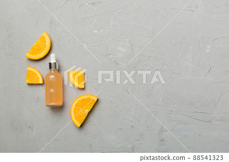 Bottles with orange fruit essential oil on wooden background. alternative medicine top view with copy space 88541323
