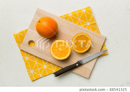Fresh ripe oranges on cutting board on table. Top view Flat lay 88541325