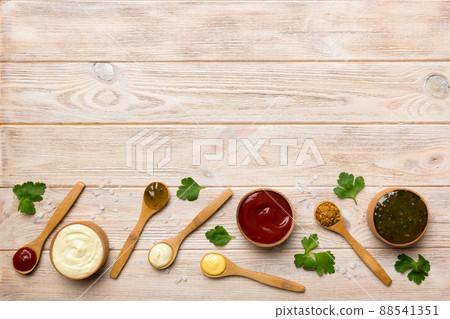 Different sauces in spoons on table background, flat lay top view Different sauces in spoons on table background, flat lay top view 88541351