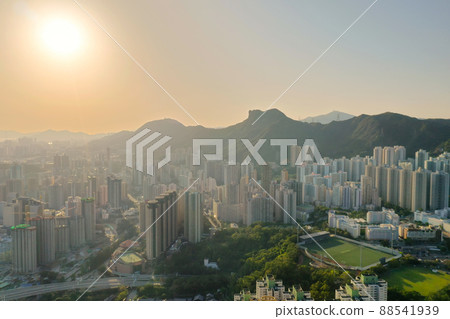sunset over Kowloon district skyline with Lion Rock hill 3 April 2022 sunset over Kowloon district skyline with Lion Rock hill 3 April 2022 88541939