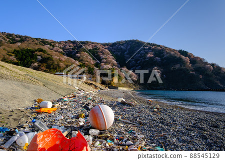 Marine debris washed ashore at the beautiful Miko beach Tsunegami Peninsula Miko 88545129