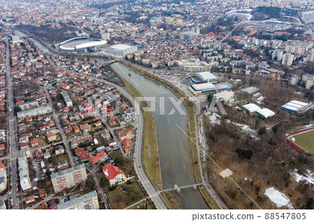 Aerial above view of river crossing the city 88547805