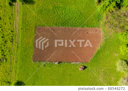 Aerial view of a plowed agricultural field 88548272
