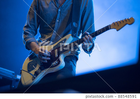 Musician's hands playing electric guitar 88548591