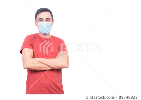 Man in medical mask standing in studio Man in medical mask standing in studio 88549922
