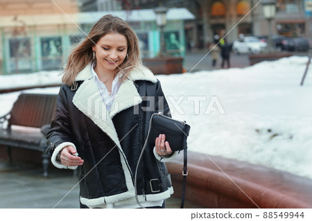 blond girl with long hair in black leather jacket closeup street portrait blond girl with long hair in black leather jacket closeup street portrait 88549944