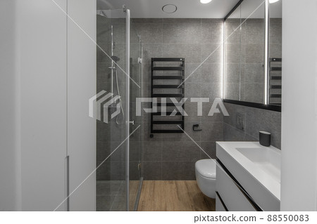 Modern minimalist bathroom interior design with grey stone tiles 88550083