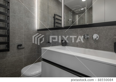 Modern minimalist bathroom interior design with grey stone tiles 88550084