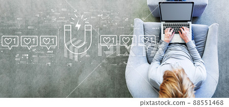 Get more likes concept with man using a laptop 88551468