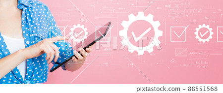 Quality control approval with woman using a tablet Quality control approval with woman using a tablet 88551568