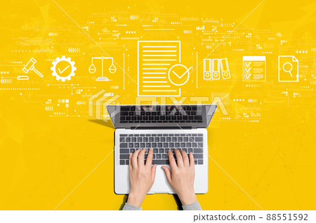 Compliance concept with person using laptop Compliance concept with person using laptop 88551592