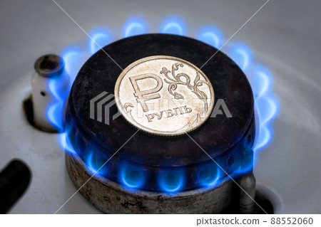 Gas burner and ruble coin, Russian money on home gas stove 88552060