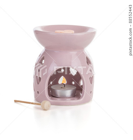 Pink perfume burner with a candle Pink perfume burner with a candle 88552443