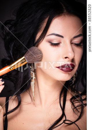 Beauty woman hold makeup professional tools mascara eyelashes brushes have clear healthy face portrait on white background Beauty woman hold makeup professional tools mascara eyelashes brushes have clear healthy face portrait on white background 88552820