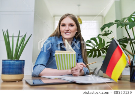 Young female student looking at webcam while talking. 88553129