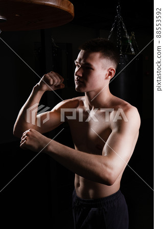 Blows the athlete bag boxer The practices glove black young male competition, In the afternoon strength muscle in punch for fit lifestyle, sportswear sweat. Person active box, one Blows the athlete bag boxer The practices glove black young male competition, In the afternoon strength muscle in punch for fit lifestyle, sportswear sweat. Person active box, one 88553592