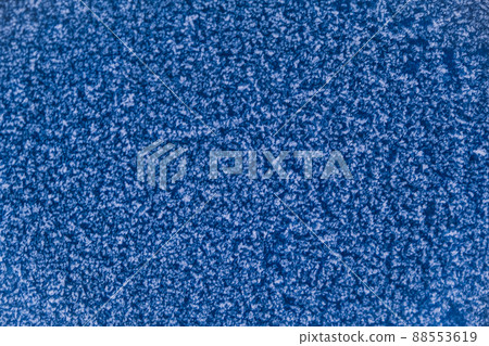 The blue wall is covered with snow patterns. Frost 88553619