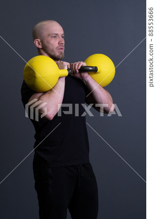 Guy with a yellow kettlebell gym anonymous young male, from motivation effort from men from rubber weightlifting, vietnamese fitness. Healthy down endurance, muscle hiit 88553666