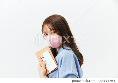 Business casual young woman with a mask 88554764