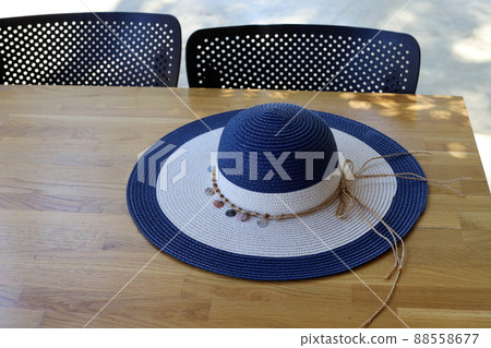 a hat to protect from the hot sun is sold in the store a hat to protect from the hot sun is sold in the store 88558677