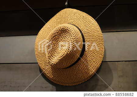 a hat to protect from the hot sun is sold in the store a hat to protect from the hot sun is sold in the store 88558682