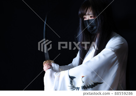 Woman cosplaying as a samurai Woman cosplaying as a samurai 88559286