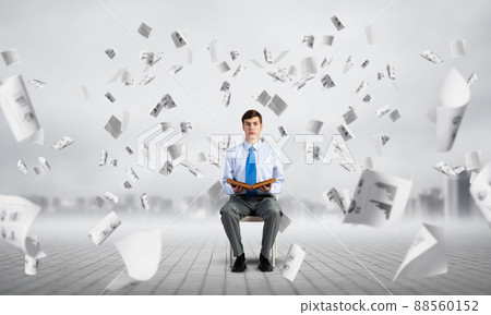 young businessman with book 88560152