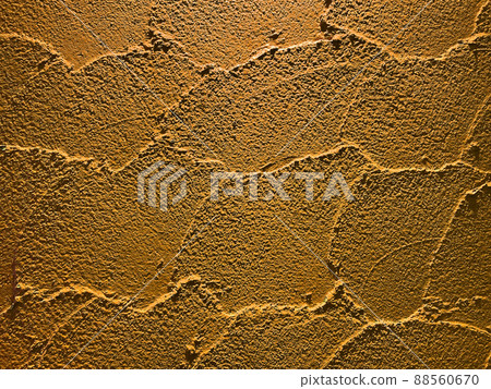 Horizontal background image of a color wall of a dark orange earthen wall with trowel marks Horizontal background image of a color wall of a dark orange earthen wall with trowel marks 88560670