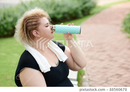 Curvy Woman Drinking Water Curvy Woman Drinking Water 88560678