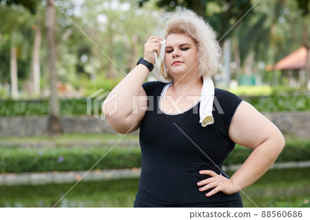 Jogger Wiping Sweat From Forehead 88560686