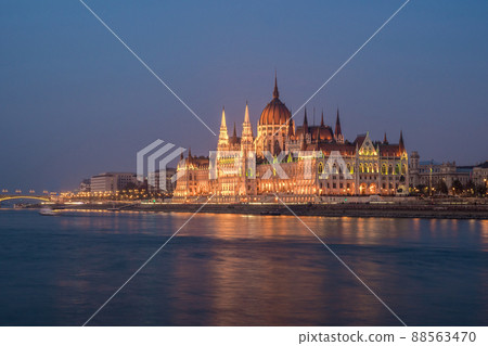 Hungarian Parliament building and Danube River in the Budapest city in the evening. A sample of neo-gothic architecture. 88563470