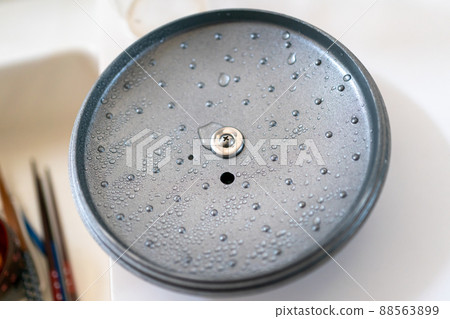 Water drops on the pot lid Water drops on the pot lid 88563899