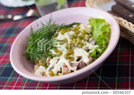 traditional with peas and mayonnaise in a pink bowl traditional with peas and mayonnaise in a pink bowl 88566107