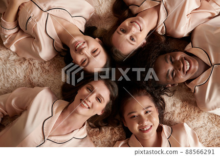 Smiling Women Lying on Floor 88566291