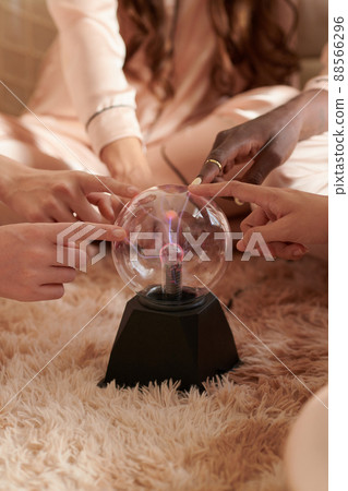 Women Touching Plasma Ball Women Touching Plasma Ball 88566296