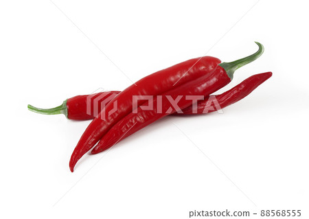 several red hot chili peppers isolated on a white background several red hot chili peppers isolated on a white background 88568555