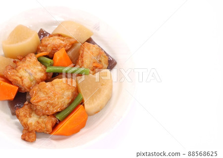 Boiled root vegetables and fried fish cake with a bright background Boiled root vegetables and fried fish cake with a bright background 88568625