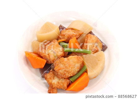 Boiled root vegetables and fried fish cake with a bright background Boiled root vegetables and fried fish cake with a bright background 88568627