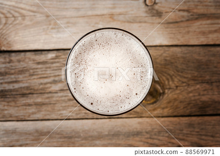 Beer glass on wooden table. Close up 88569971