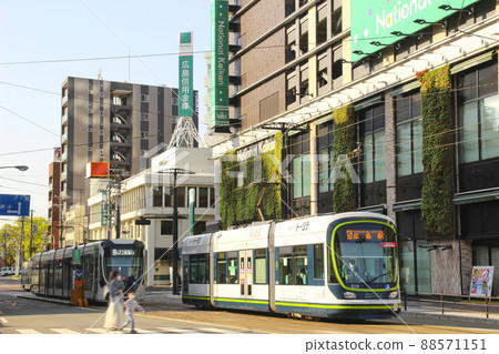 Tram running in Hiroshima City / Minami Ward, Hiroshima City, Hiroshima Prefecture 88571151