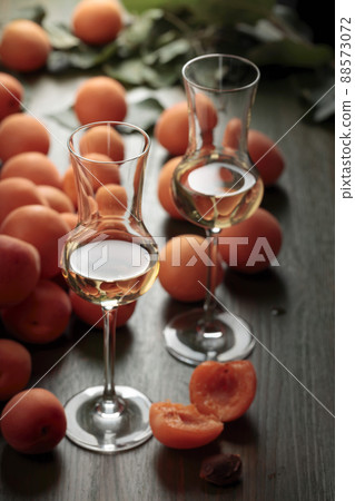Apricot liquor with fresh fruits. 88573072