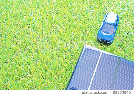The lawn, one blue hydrogen vehicle in the upper right, and the solar panel in the lower right 88573940